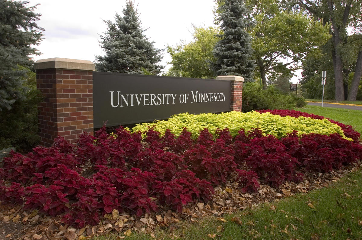 University of Minnesota entrance sign with flowers
