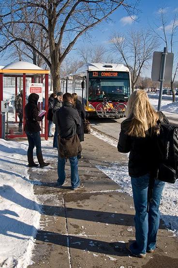 The U's campus connector arriving at a bus stop